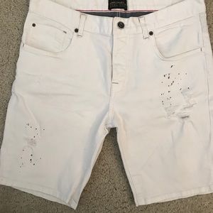 men’s white denim shorts with paint splatter look